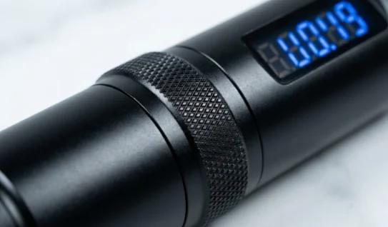 Close-up of a wireless tattoo pen adjustment ring.