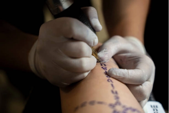 tattoo artist doing tattoos